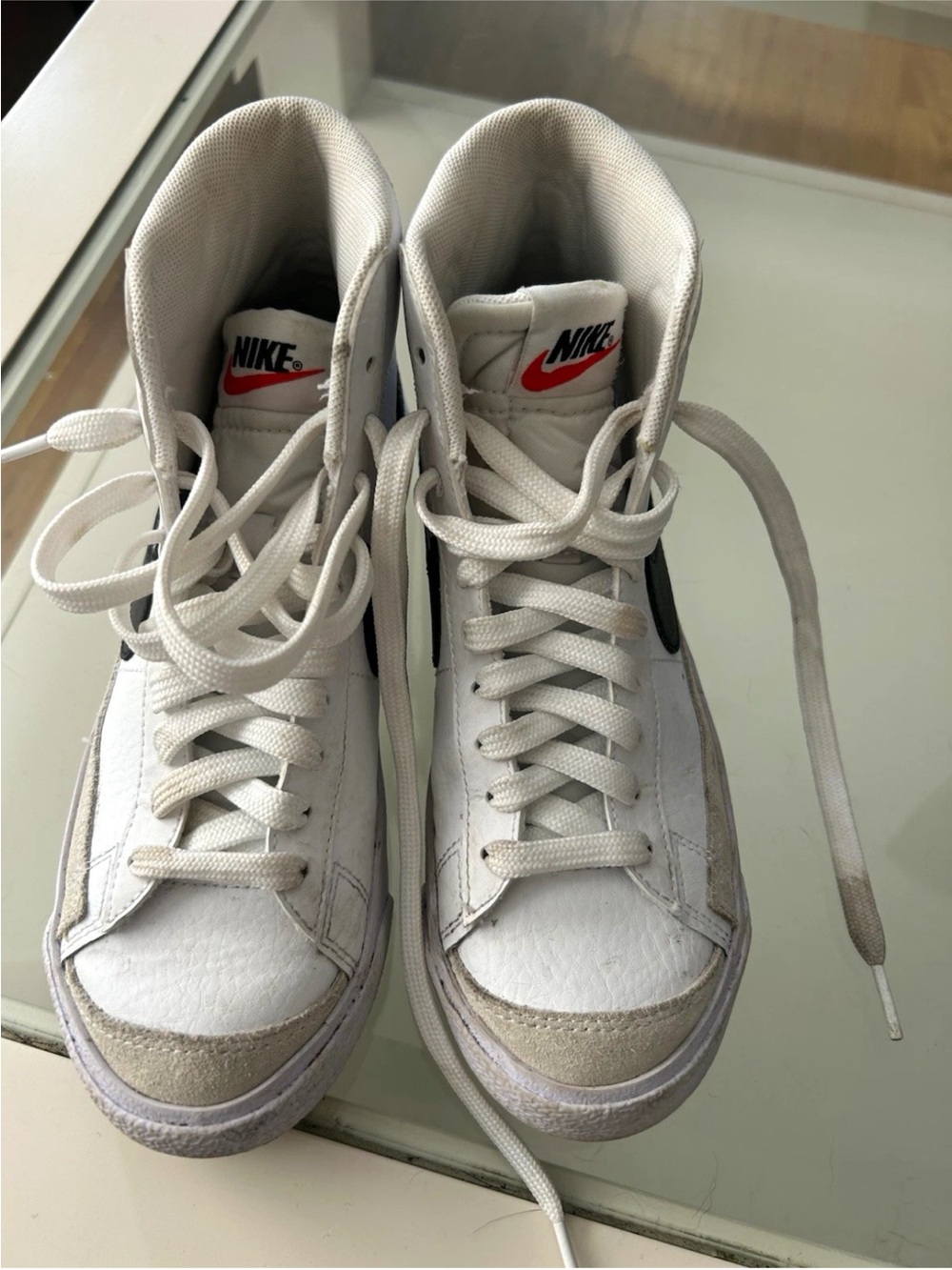 Nike White High-Top Sneakers with Black Swoosh and Red Logo